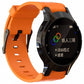 Orange silicone sport watch band with perforated strap and black watch holder.