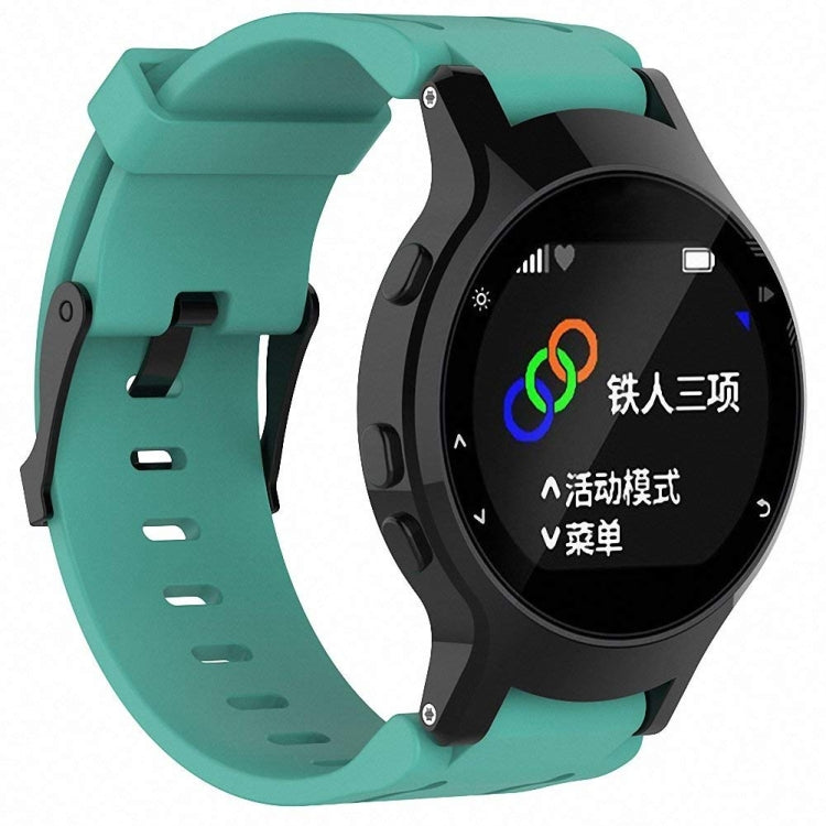 Mint green silicone sport watch band with perforated strap and black watch holder.