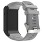 Grey silicone sport watch band with textured pattern and metal buckle clasp