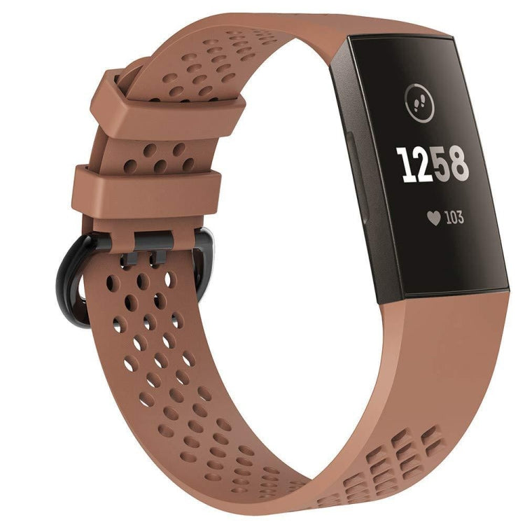 Brown perforated sport watch band with adjustable strap and textured clasp area.