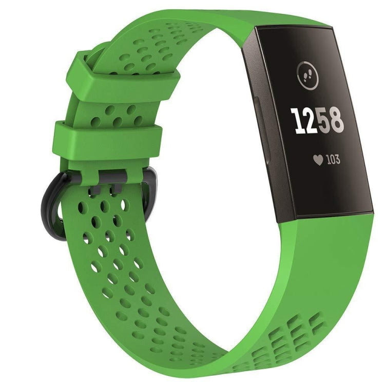 Green perforated sport watch band with adjustable strap and textured clasp area.
