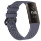 Navy blue perforated sport watch band with adjustable strap and textured clasp area.