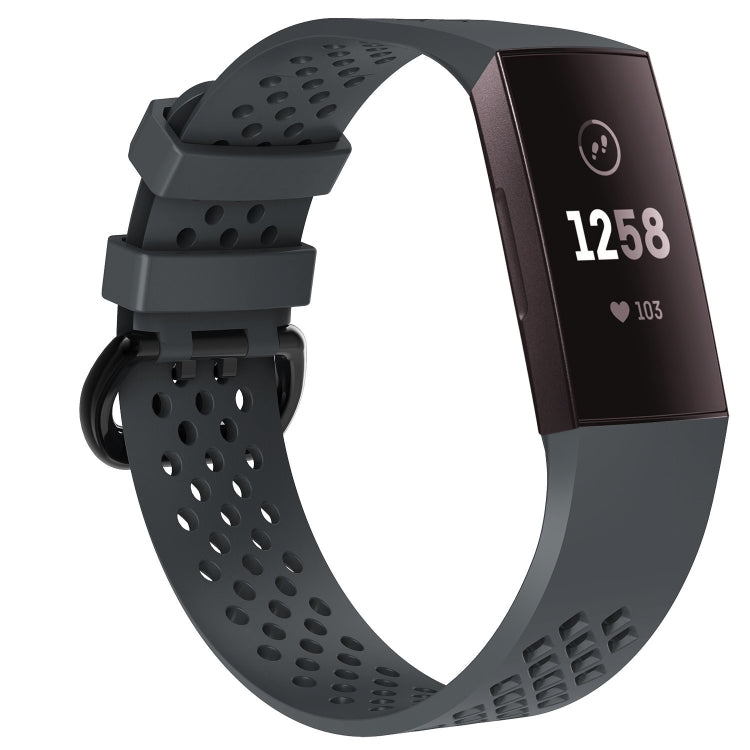 Grey perforated sport watch band with adjustable strap and textured clasp area.