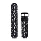Silicone sport watch band with black speckled pattern, white perforated dots and black clasp