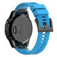 Blue silicone watch band with textured surface and quick-release attachment