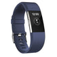 Dark blue silicone sport watch band with adjustable holes and silver buckle hardware
