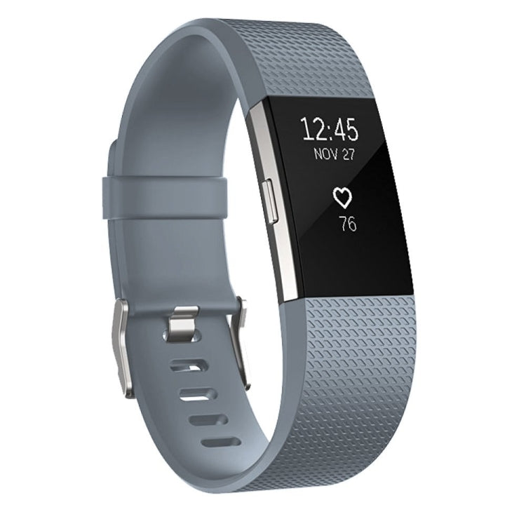 Gray silicone sport watch band with adjustable holes and silver buckle hardware