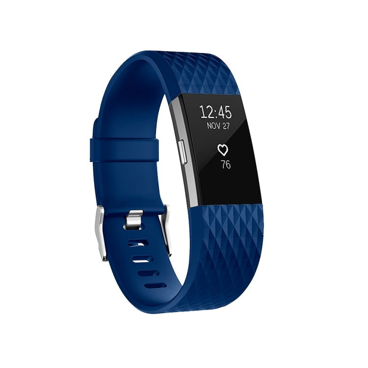 Blue diamond-pattern sport watch band with perforations and metal buckle clasp on display.