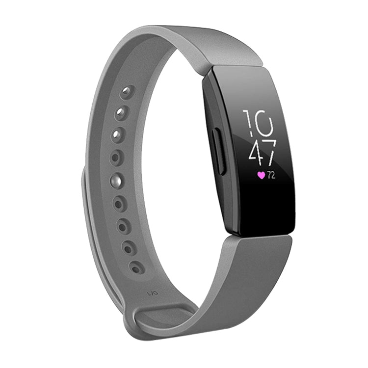 Grey silicone watch band with perforated strap and black smartwatch display