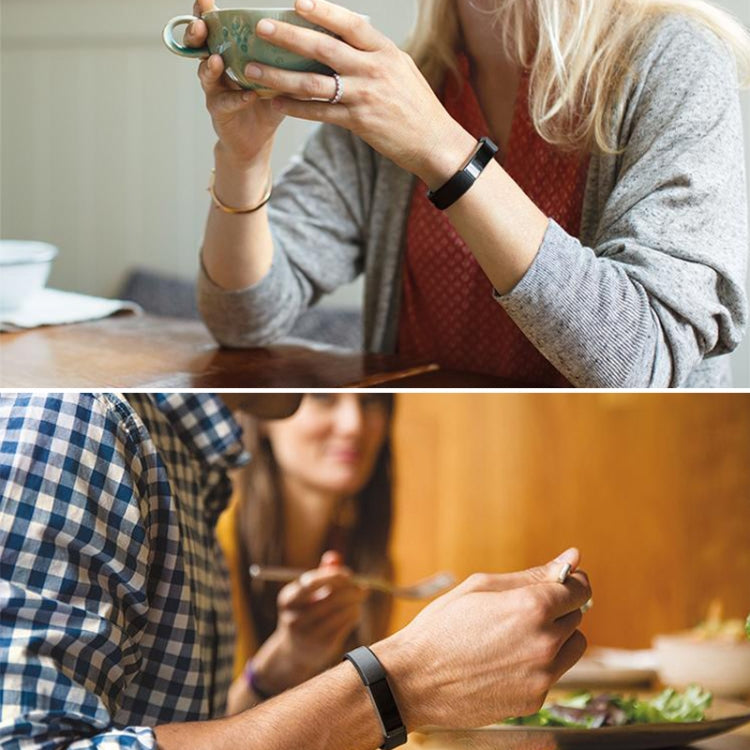 Black smartwatch on wrist with matching black watch band