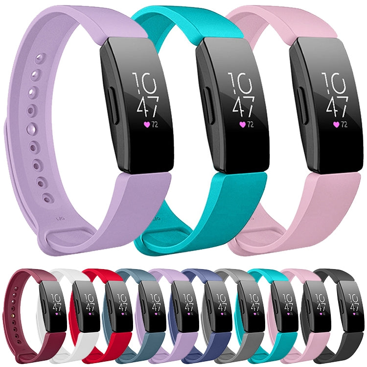 Assorted silicone smartwatch bands in purple, teal, pink, red, white, and grey
