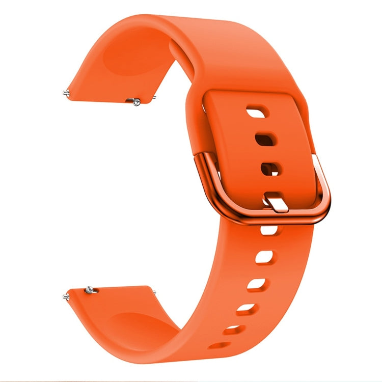 Orange silicone watch band with metal clasp buckle, end holes visible