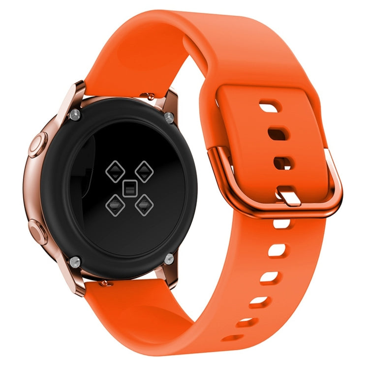 Orange silicone watch band with metal buckle and vented strap holes