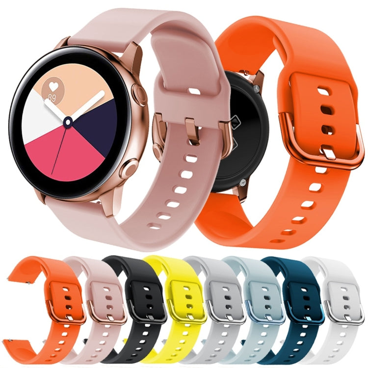 Pink and orange silicone watch bands with metal buckles, plus multiple color bands
