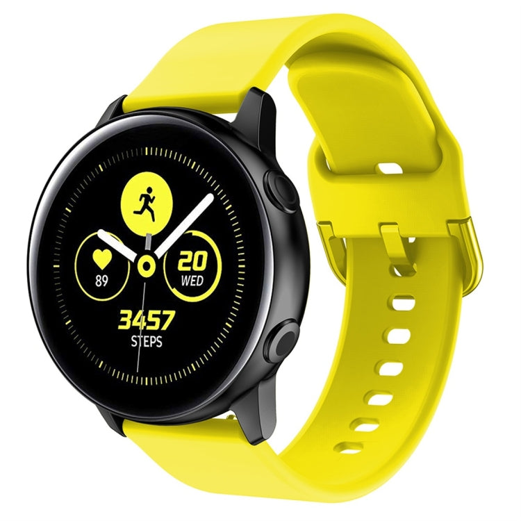 Yellow silicone watch band with metal buckle and perforated strap holes
