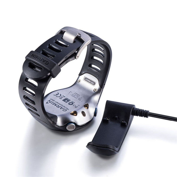 Charging cradle and black cable attached to the Garmin Forerunner 610