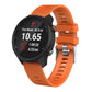 Orange silicone smartwatch band with textured strap and metal clasp