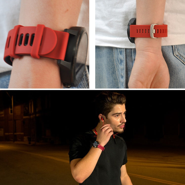 Red silicone watch band on wrist for Garmin Forerunner 245, with silver buckle