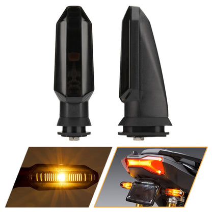 2 LED motorcycle turn signal lights, black housing with dark clear lens and amber glow