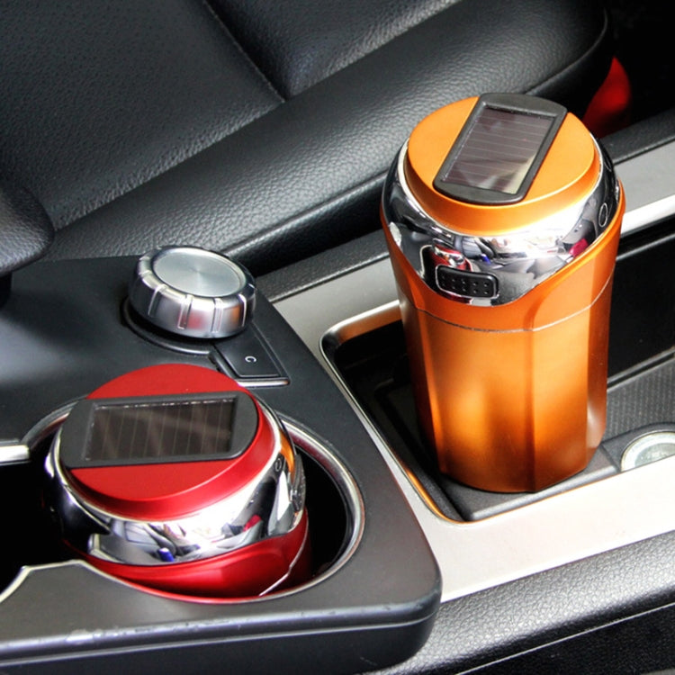 Orange-gold solar car ashtray with lighter, shown in the center console