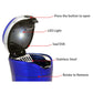 Blue car ashtray open with LED light showing, solar lid, and stainless interior