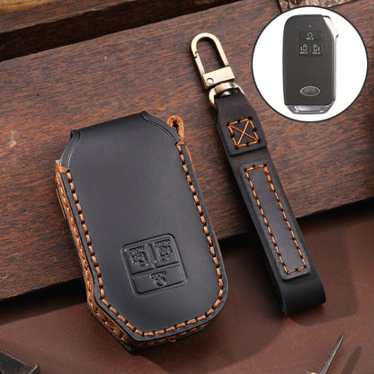 Leather key fob cover, dark gray with orange edge stitching and embossed emblem