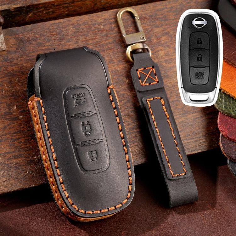 Black leather key fob cover with orange stitching and key ring loop