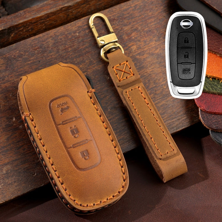 Brown leather key fob cover with tan stitching and key ring loop