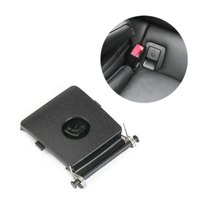 Black ISOFIX switch cover for child safety seat, with circular logo and metal mounting clips