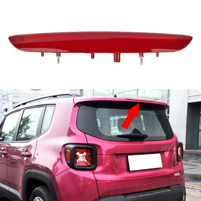 Red high-mount brake light mounted on SUV rear window