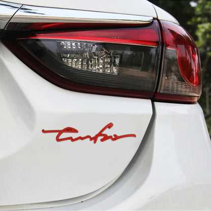 Red cursive car decorative sticker applied on car body near the rear light