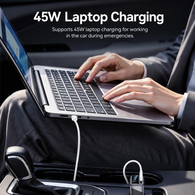 Car charger connected by USB cable charging a laptop on a car seat