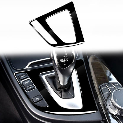 Black decorative gear panel sticker with chrome trim, left-drive console bezel