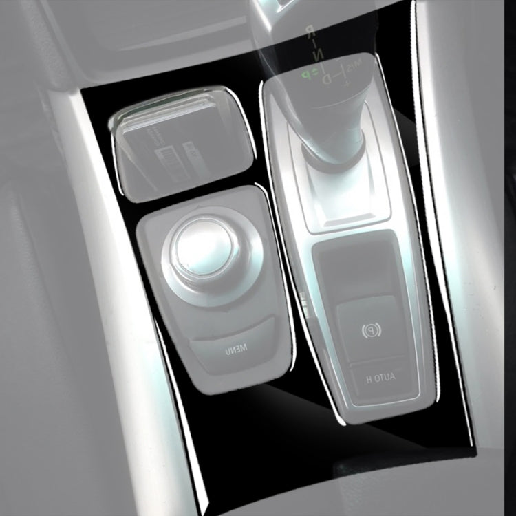 Black gear panel overlay sticker with cutouts around shifter and console buttons