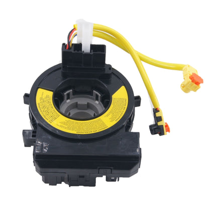 Spiral clock spring contact with yellow cable and multi-pin connectors, black housing
