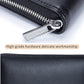 Black leather card holder wallet with metal zipper and rounded edge tab detail