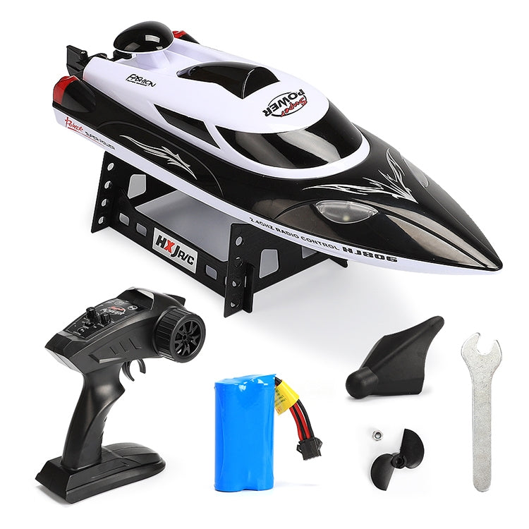 White and black racing speedboat with black remote controller and included parts