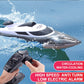 White and black RC racing yacht with remote controller, water spray and droplets