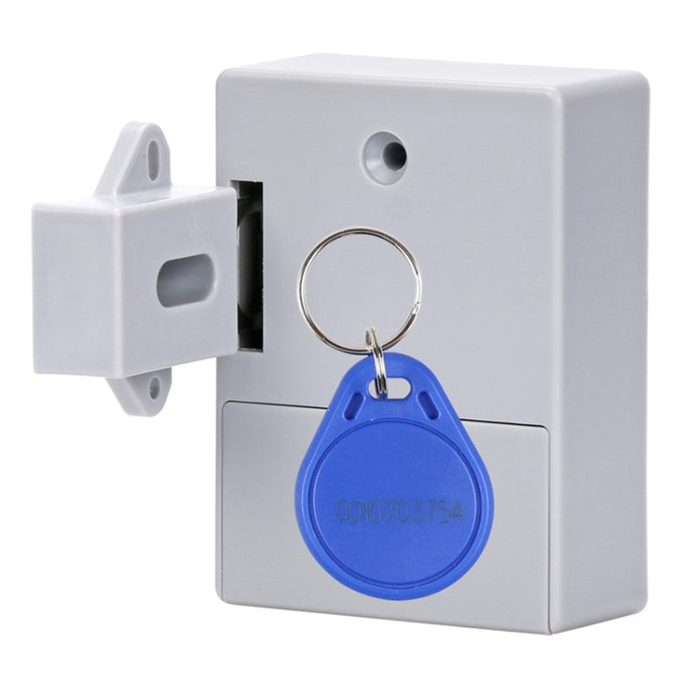 White induction cabinet lock with blue key fob on metal key ring