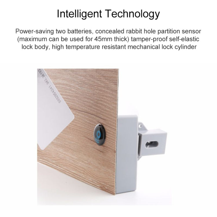 White induction cabinet lock mounted on wood panel with blue key fob