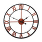 Round wall clock with Roman numeral-style ring, black frame and rust accents
