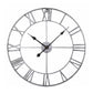 Round wall clock with Roman numeral-style ring, silver frame and black hands