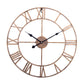 Bronze round wall clock with white face, dark hands, and Roman numeral markers