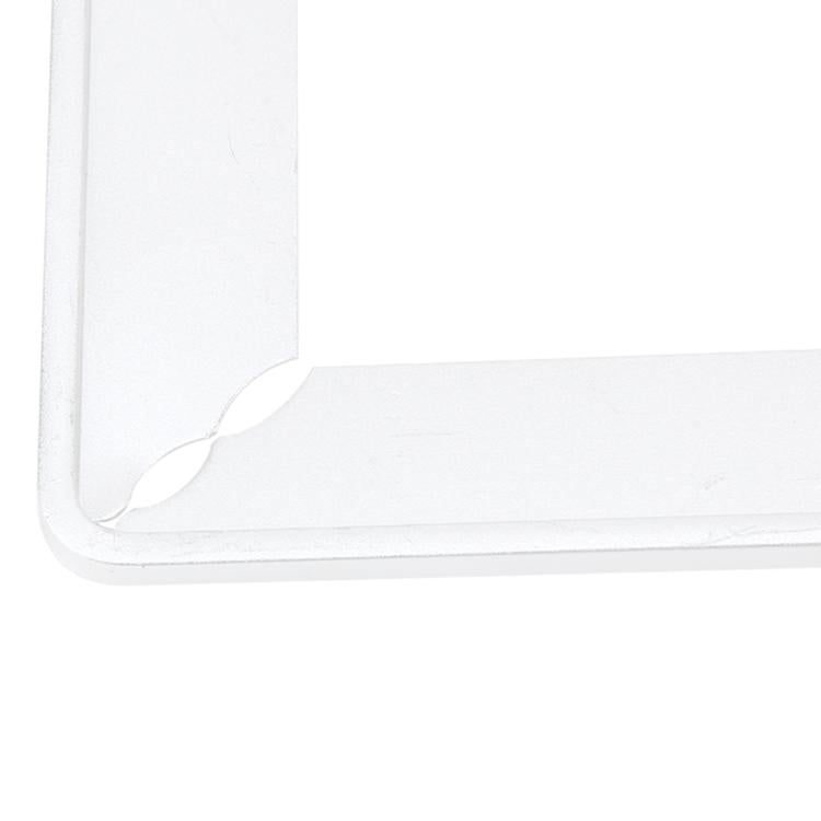 Corner close-up of a white/silver license plate frame holder with mounting bracket