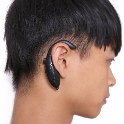 Black anti-sleep driver alarm ear clip worn behind ear, side profile view
