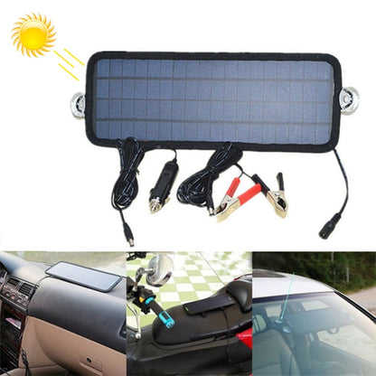 Portable solar battery charger with rectangular solar panel, suction caps, and charging leads