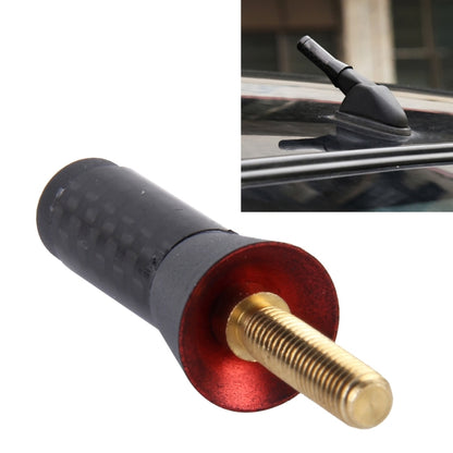Short car antenna with carbon-fiber sleeve, red base, and gold threaded screw