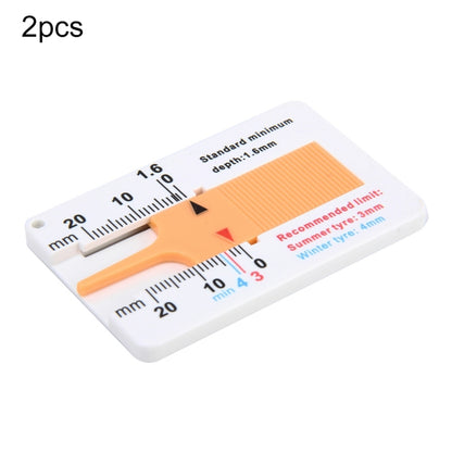 Plastic tire tread depth gauge, 0–20 mm scale with orange indicator tab on white base