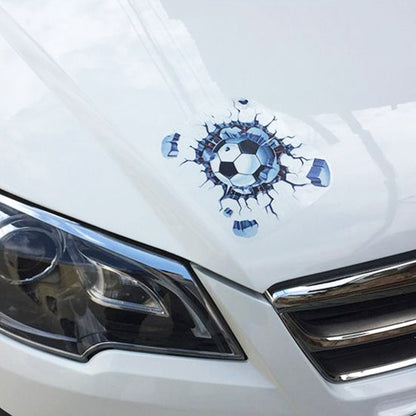 White car hood with blue 3D soccer ball explosion sticker centered above the front grille
