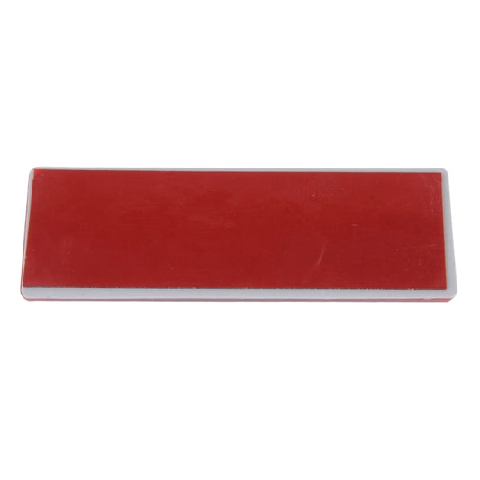 Red rectangular reflector lens with clear border and two mounting points